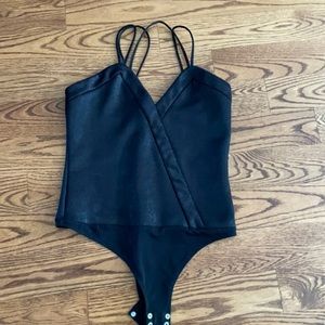 Dynamite black bodysuit.